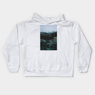 Ito at Dusk with cloud filled mountains in the background Kids Hoodie